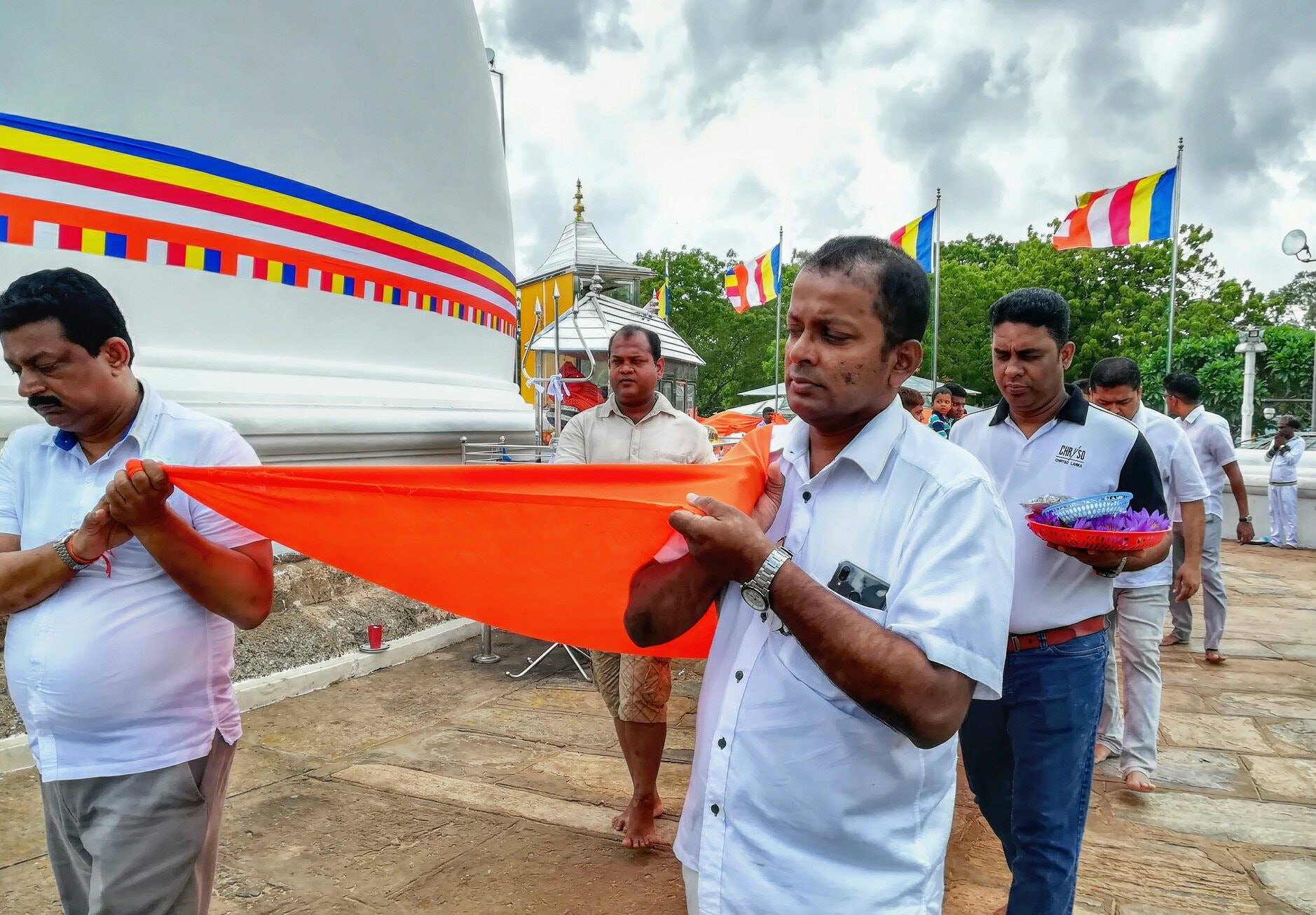 Devotees carrying the kanchuka cloth at the stupa